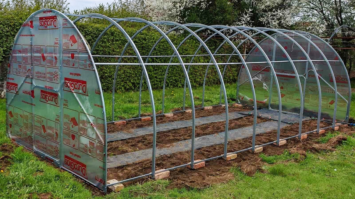 A Plot 3.14 frame standing on its base, with both end walls fitted and the arches still bare