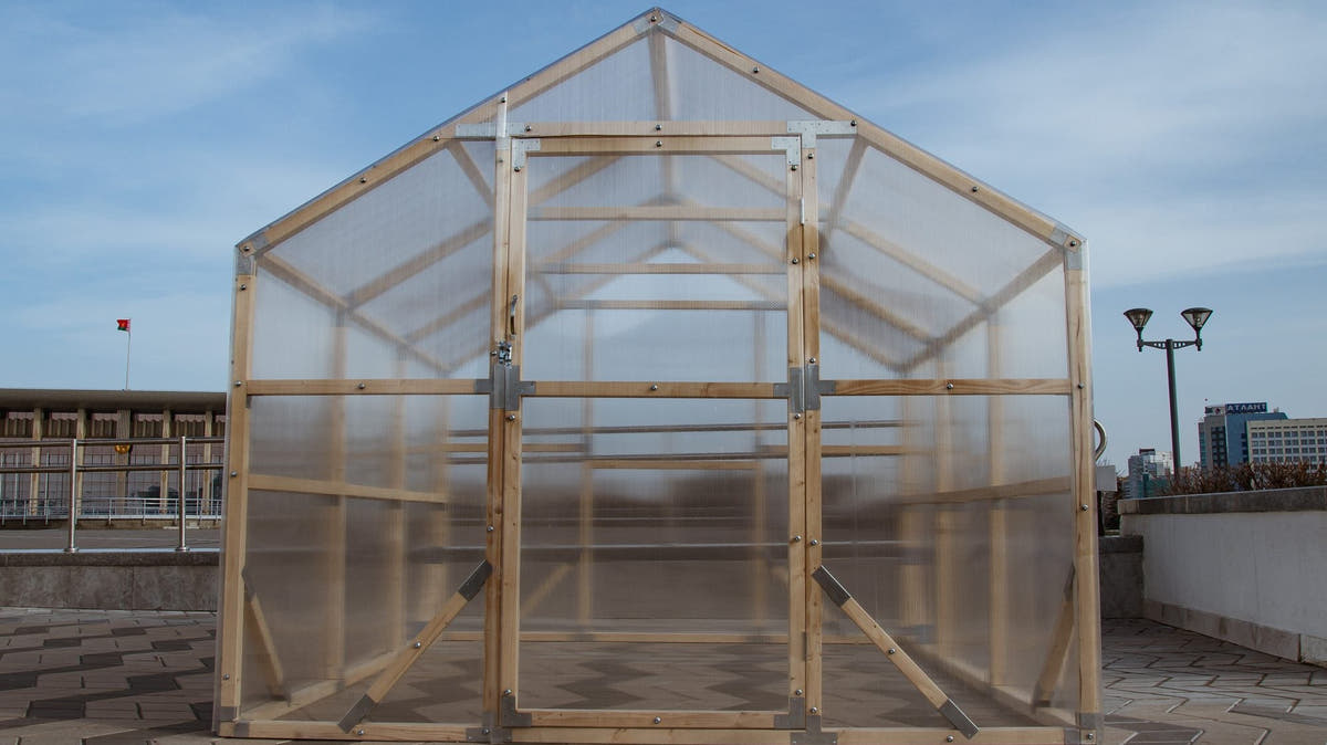 NORDIC wooden greenhouse from the front, showing the ridge, door and twin-wall polycarbonate
