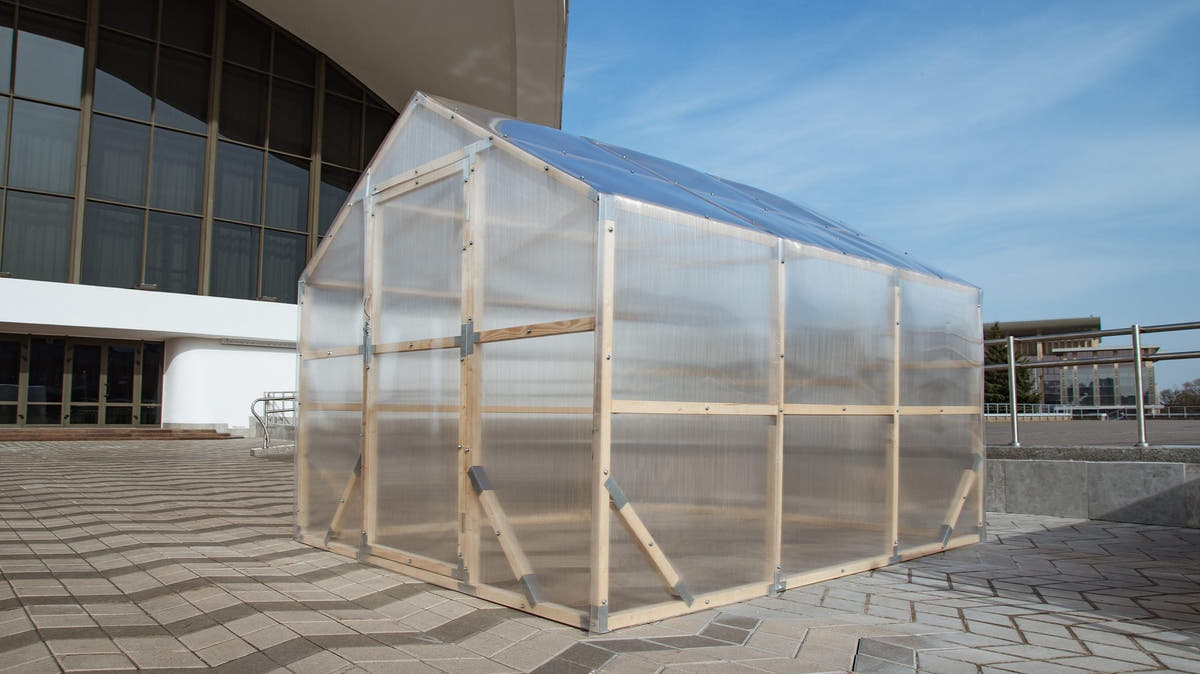 NORDIC wooden greenhouse in three-quarter view with twin-wall polycarbonate glazing