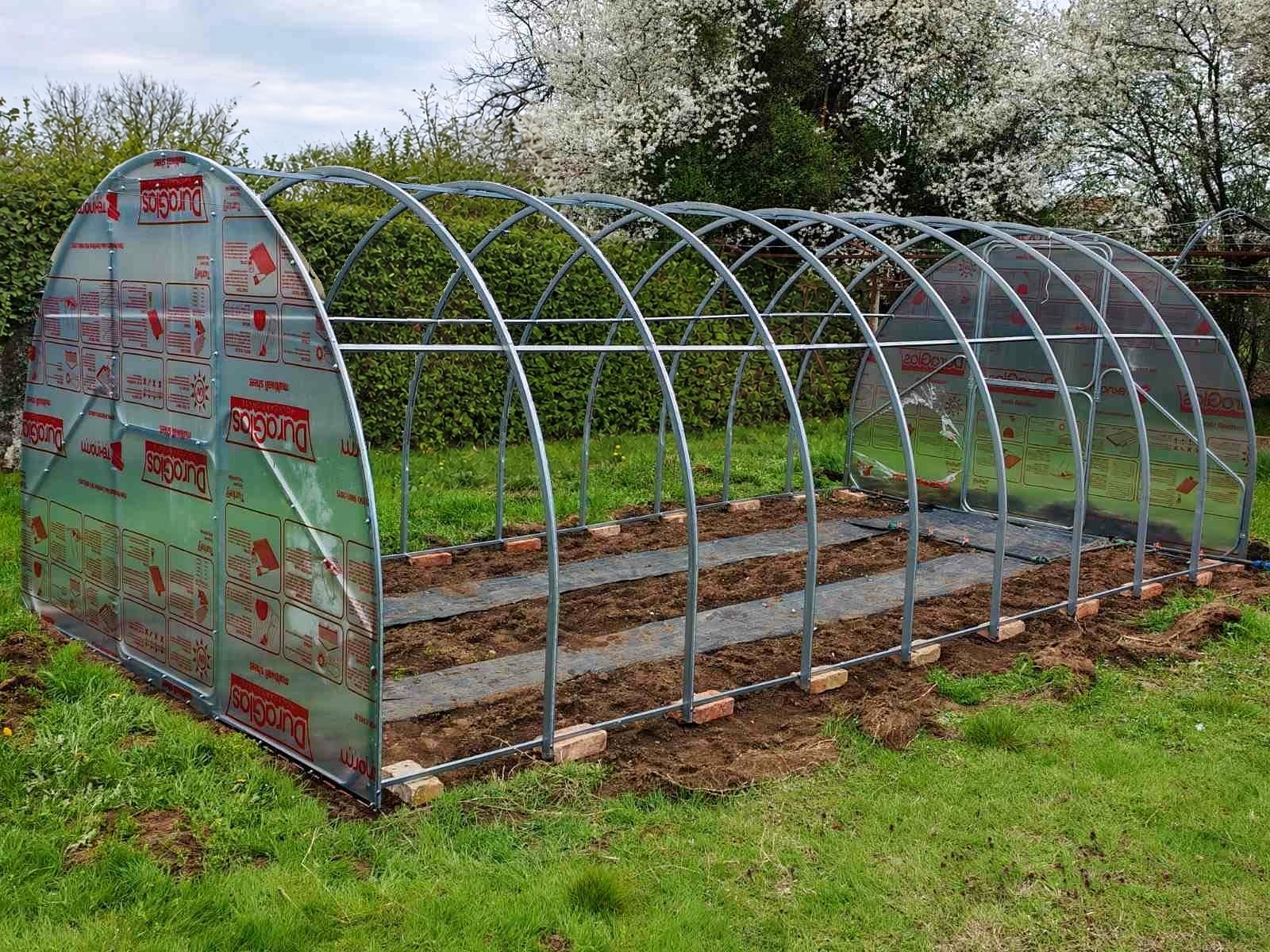 A Plot 3.14 frame standing on its base, with both end walls fitted and the arches still bare