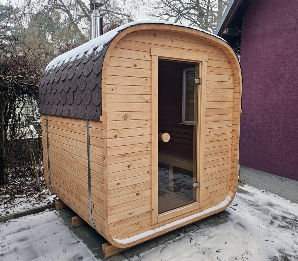 The Cabin Three electric outdoor sauna with a bitumen shingle roof