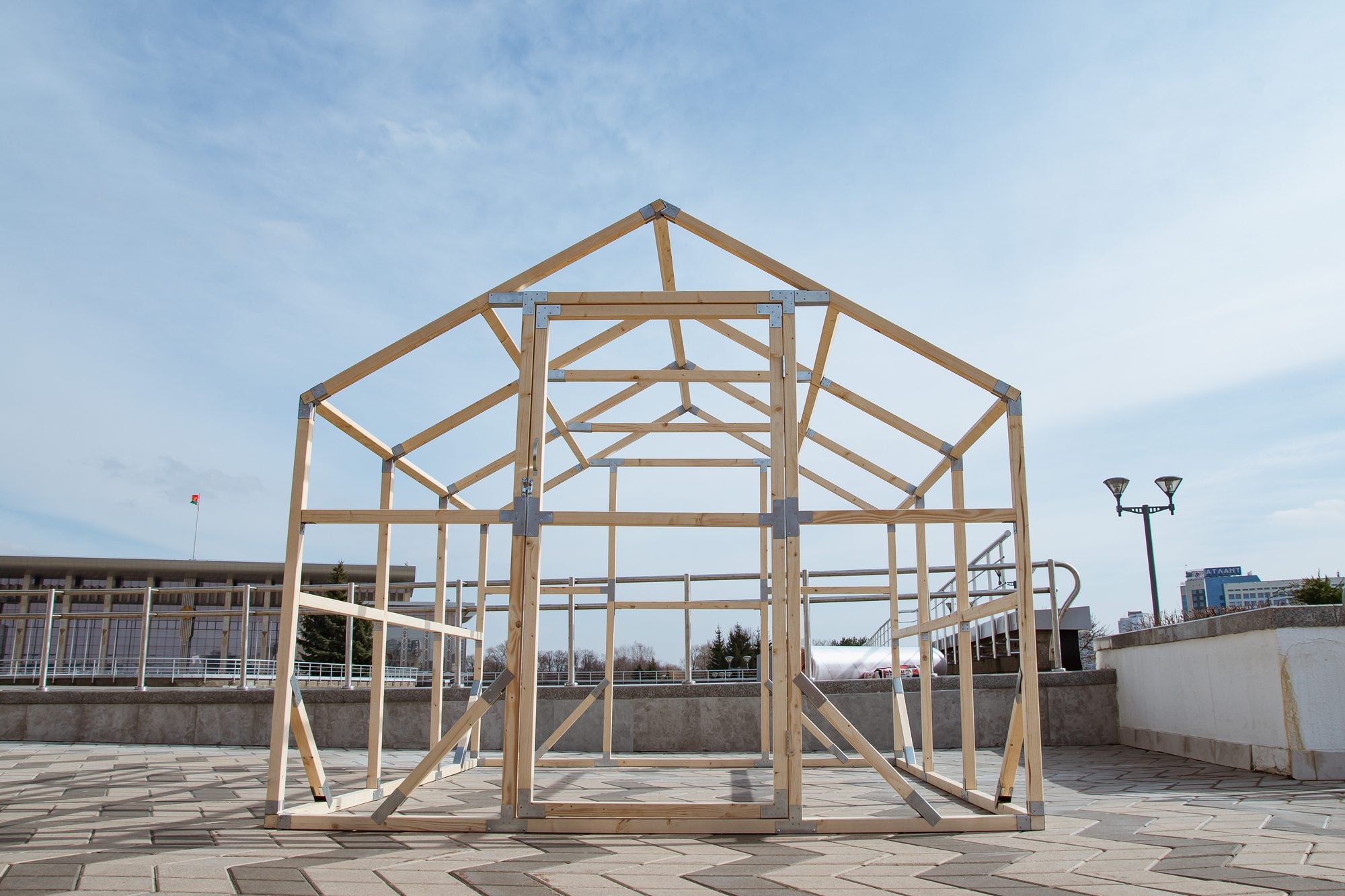 Front of a NORDIC greenhouse frame in Swedish pine, door opening and roof trusses in place