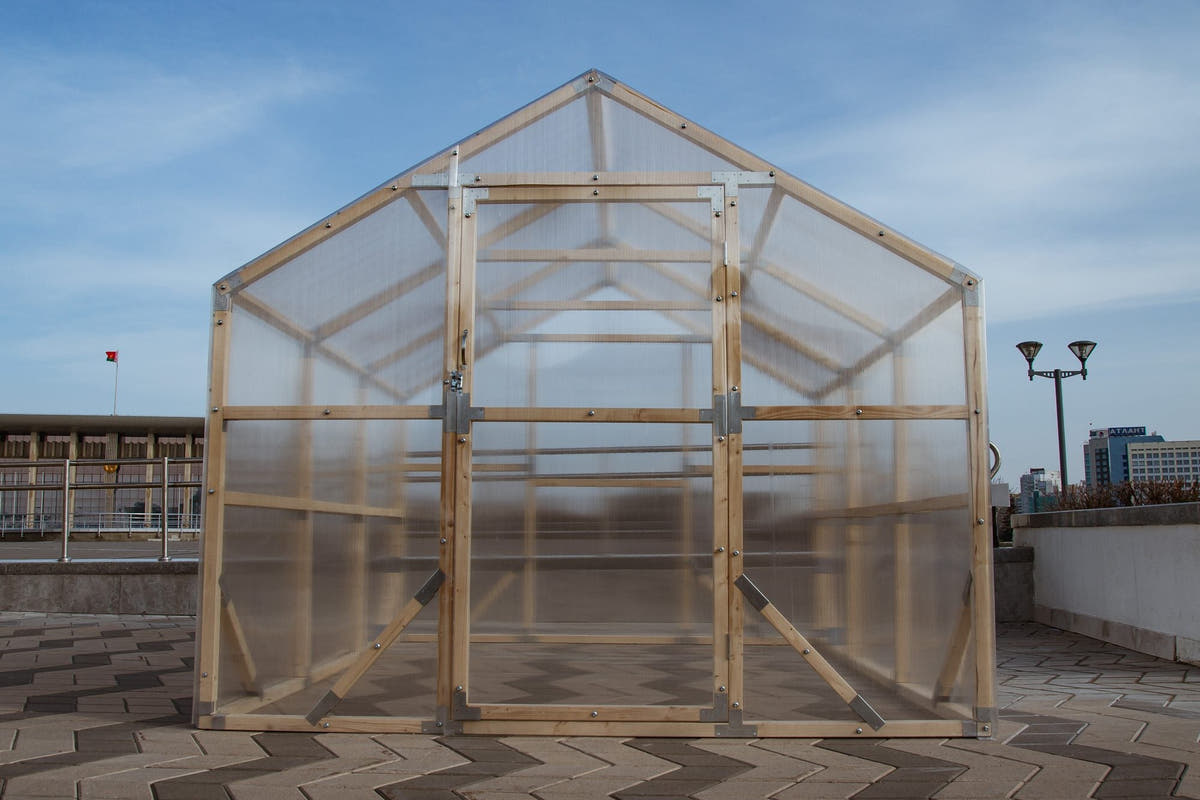 NORDIC wooden greenhouse from the front, showing the ridge, door and twin-wall polycarbonate