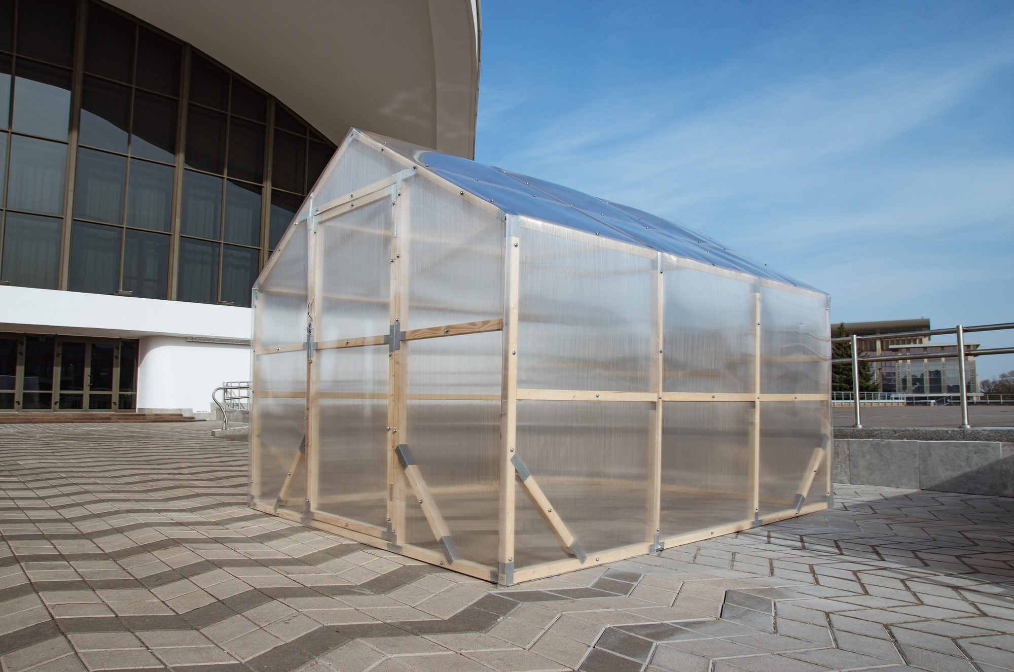 NORDIC wooden greenhouse in three-quarter view with twin-wall polycarbonate glazing