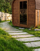 CUBIO 180 sauna in a garden at dusk