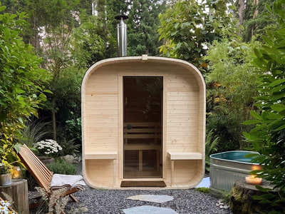 The Cabin Four outdoor sauna at the end of a stepping-stone garden path