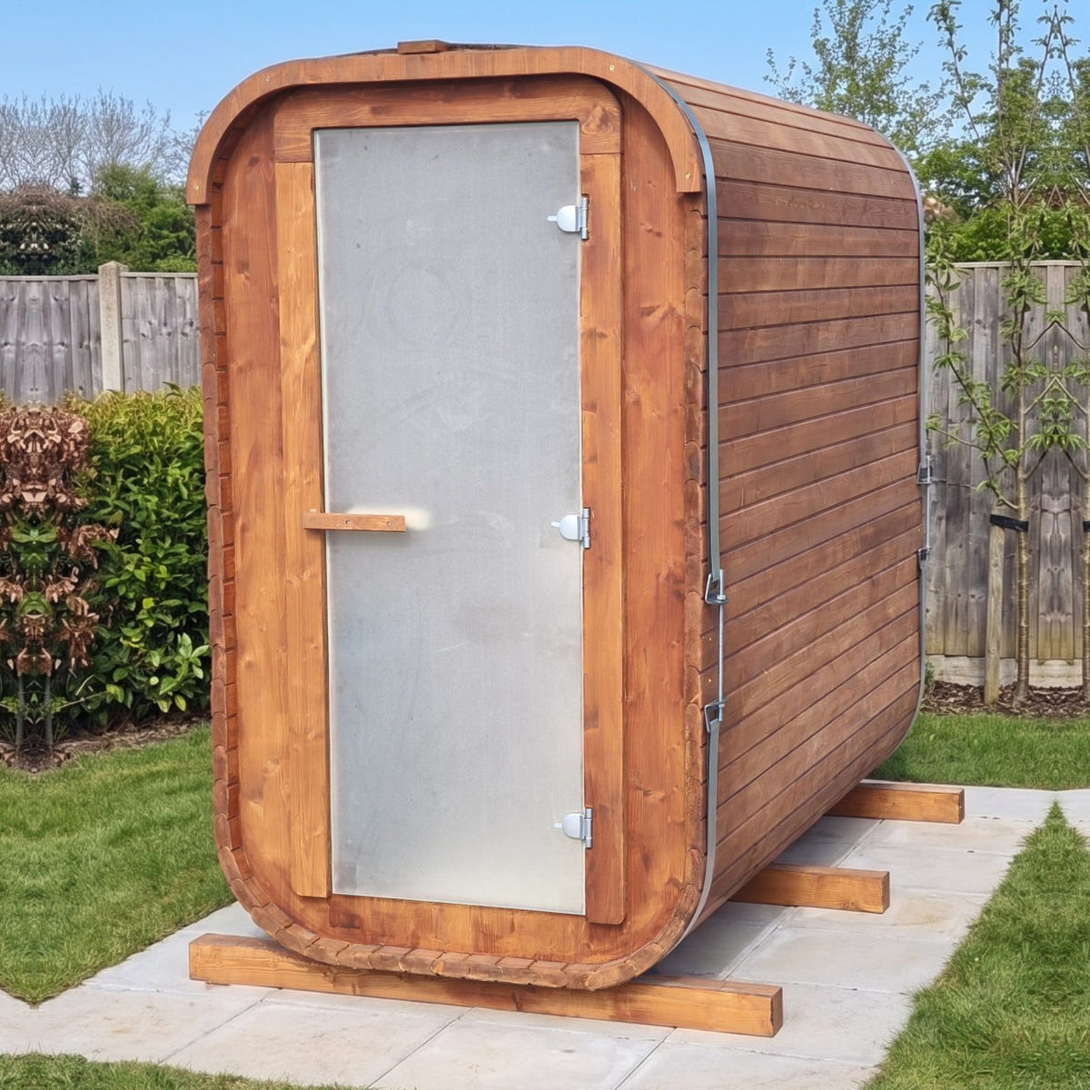 The Slim Two XL electric sauna, three-quarter view: the frosted glass door and the long side wall