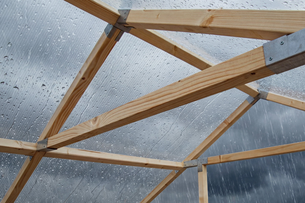 Inside Waldenhaus greenhouse, 45mm Swedish pine frame with polycarbonate panels retaining heat in winter