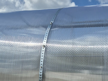 A steel strap over the sheet, along the arch