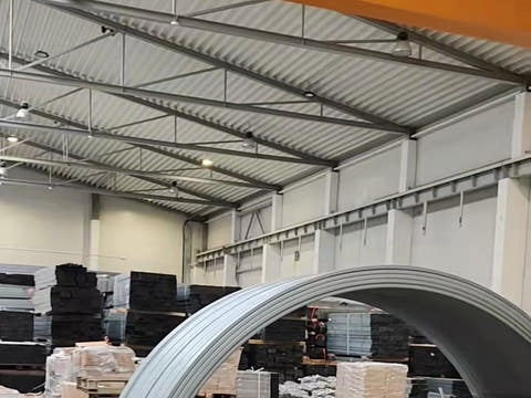 The production hall with steel profile and bent arches in stock